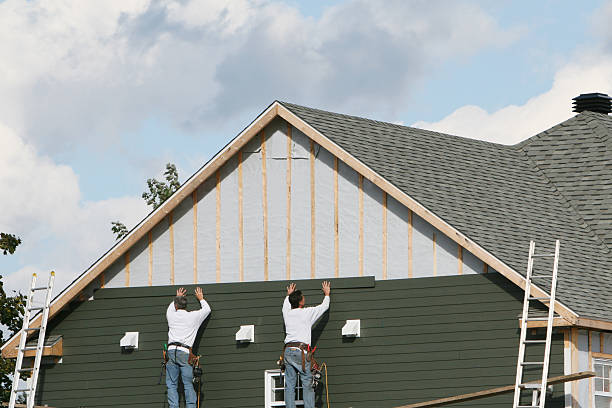 Professional Storm Damage Siding Repair technician working in Quincy, PA